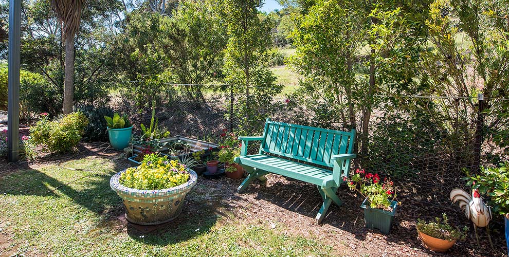 Outdoor seating surrounded by plants