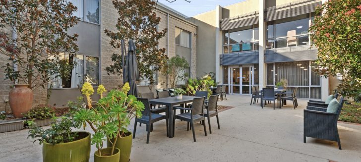 Courtyard with multiple tables and plants