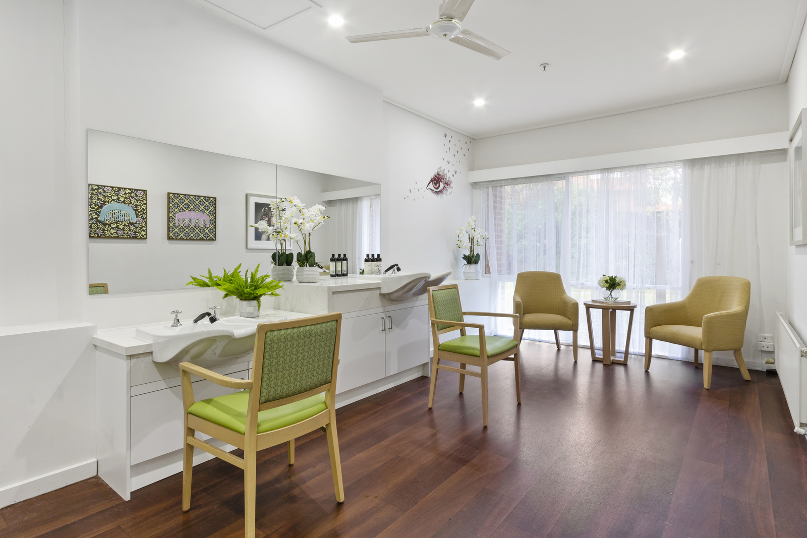 Airy salon with green chairs