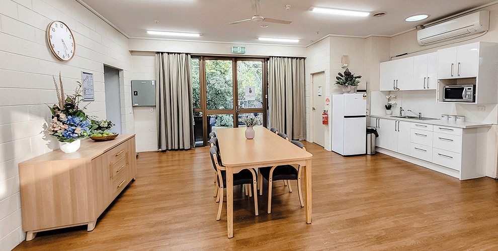 Kitchen with a table in the centre of the image