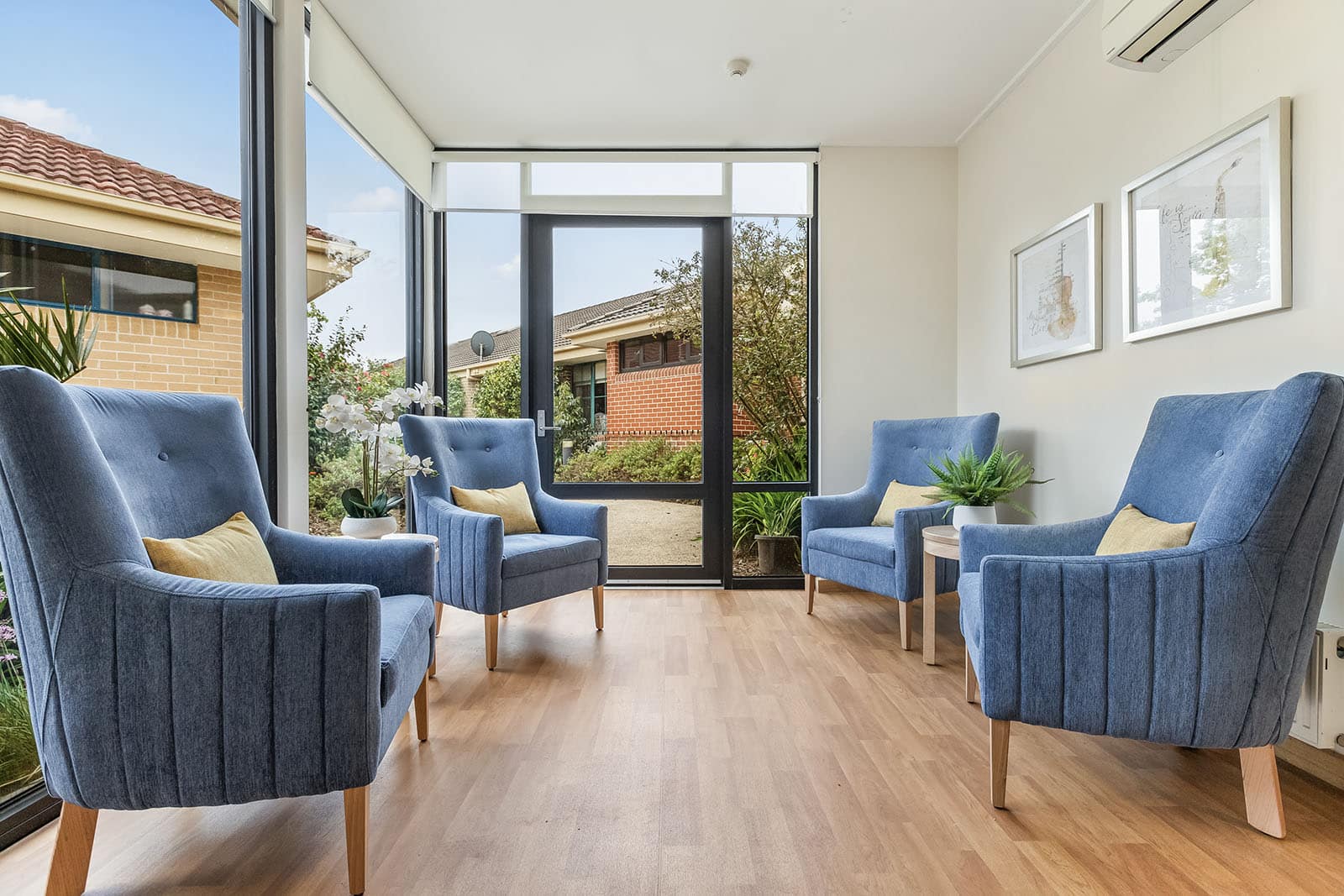 Sitting room with wide windows and armchairs