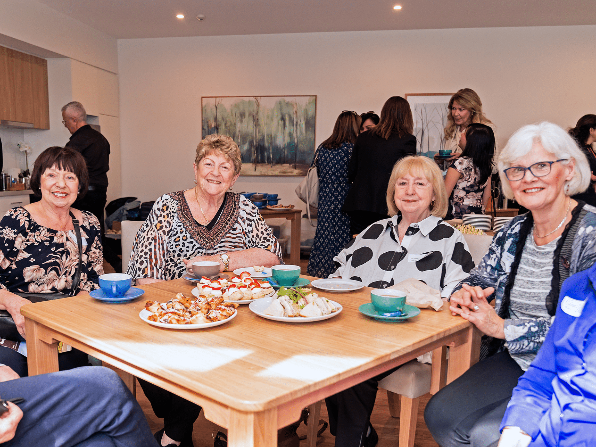 Four ladies sit at a table