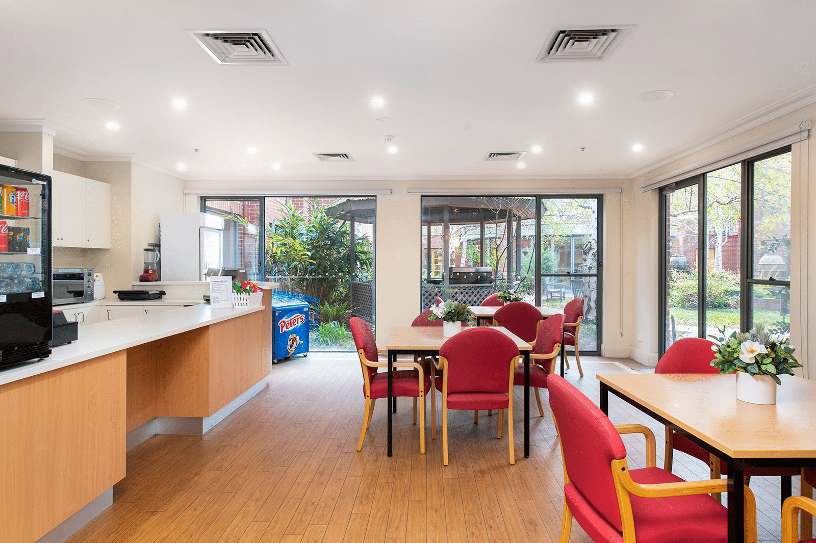 Cafe with tables of comfortable red chairs