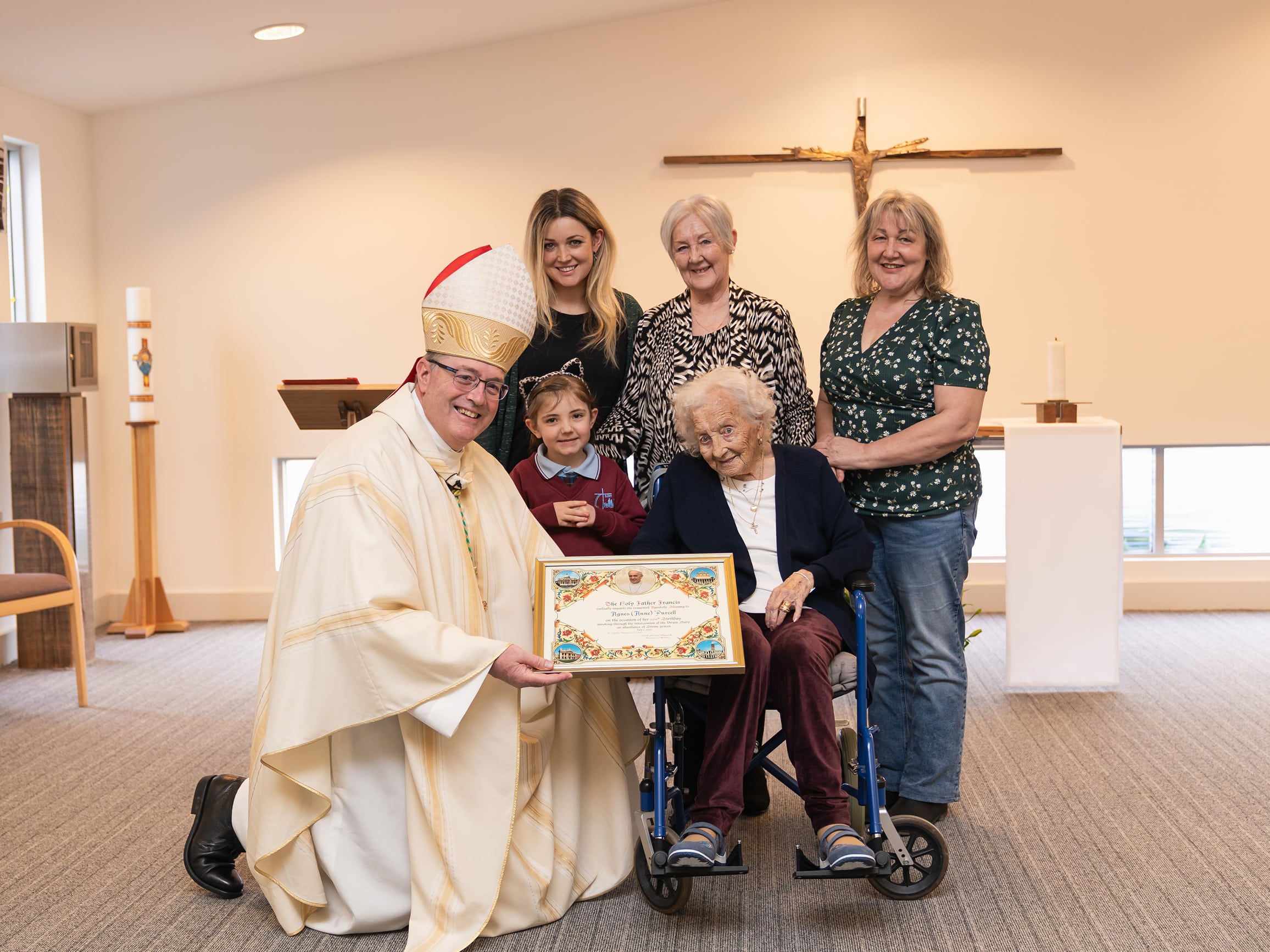 Anne Purcell pictured with Bishop Greg Bennet and family