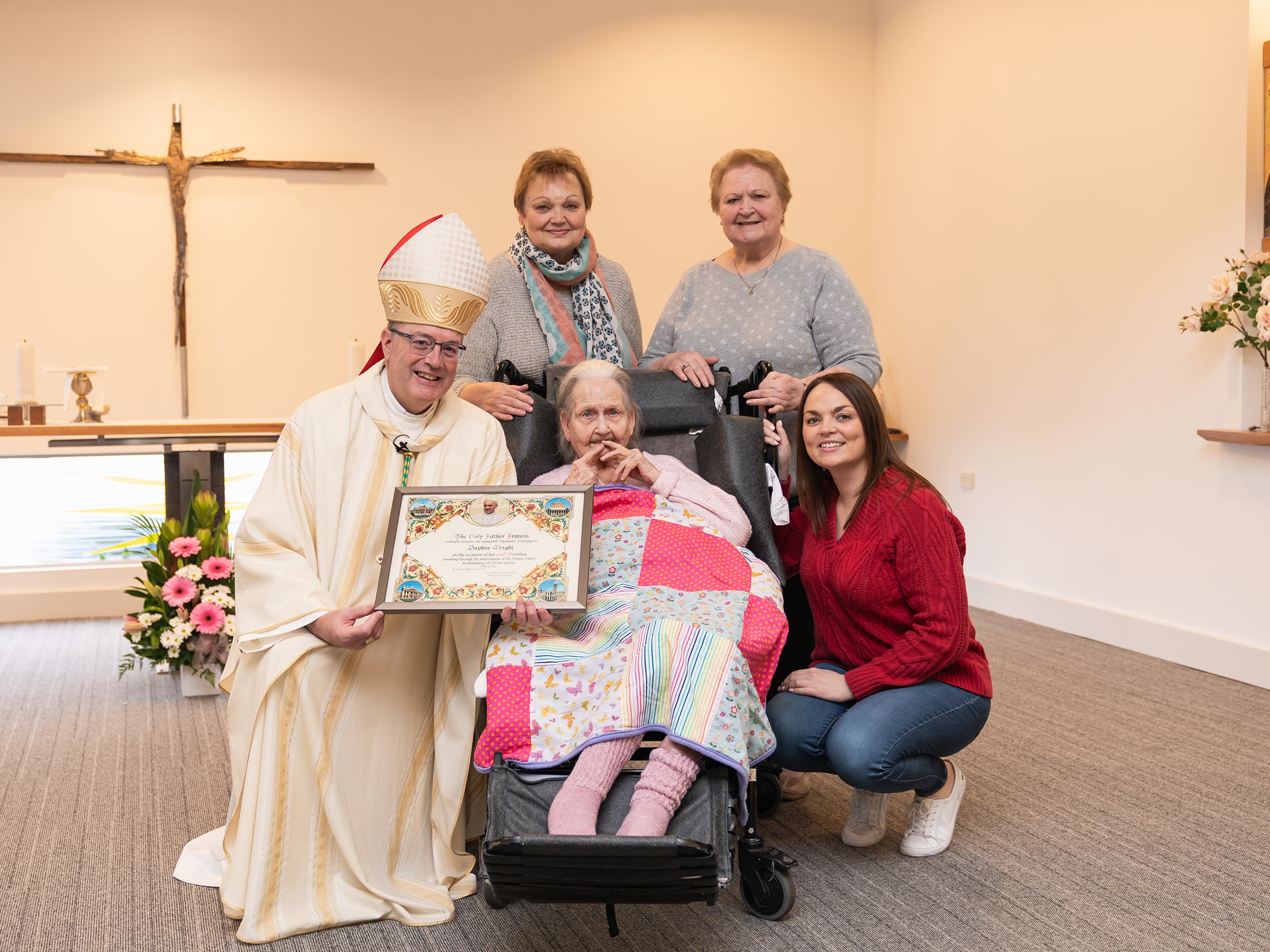 Daphne Wright pictured with Bishop Greg Bennet and family