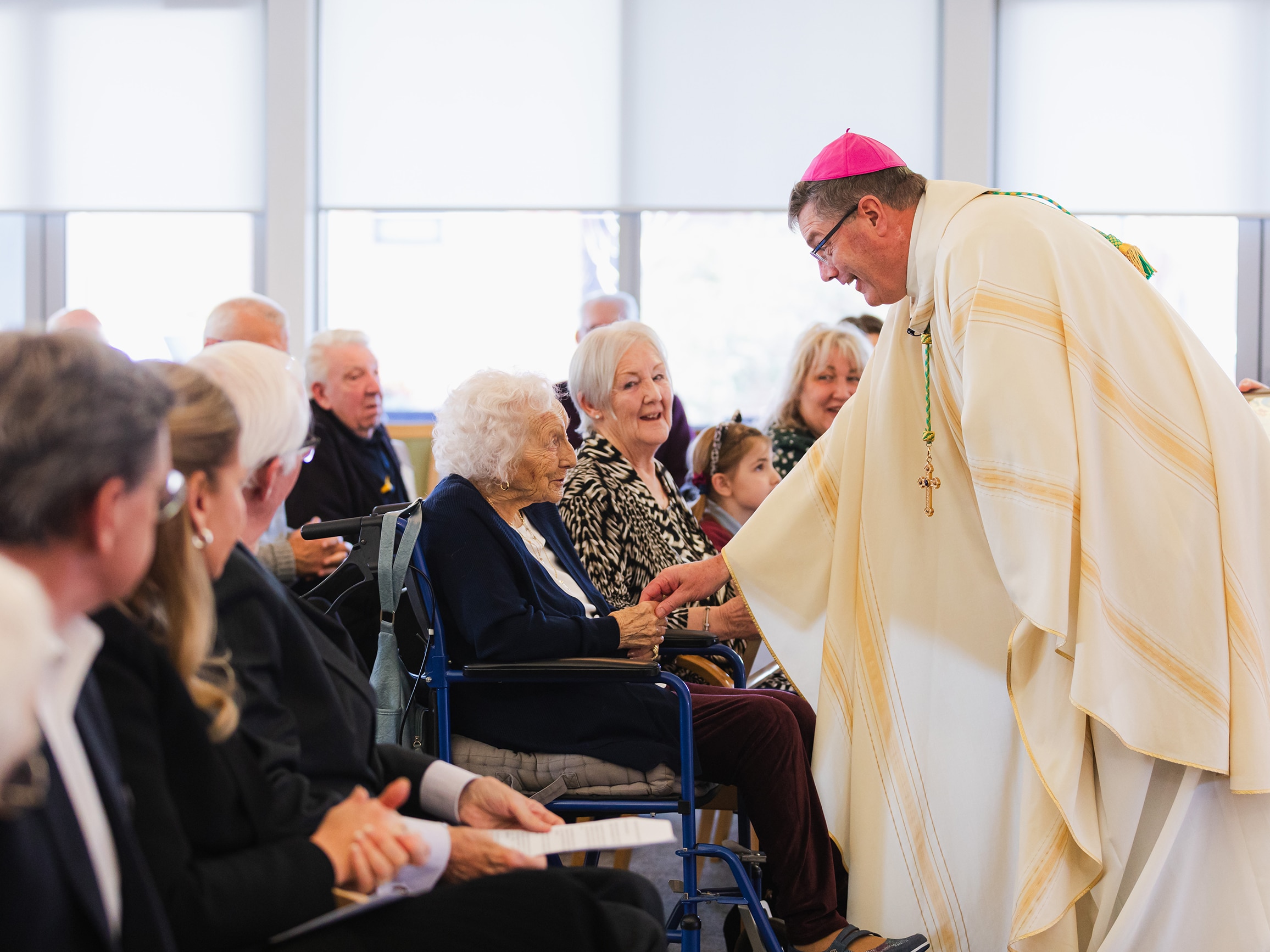 Bishop Greg greets Anne and family