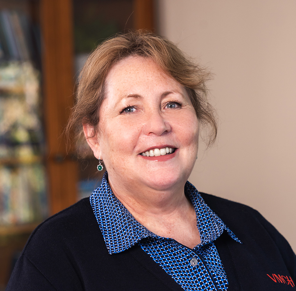 A woman smiling at the camera