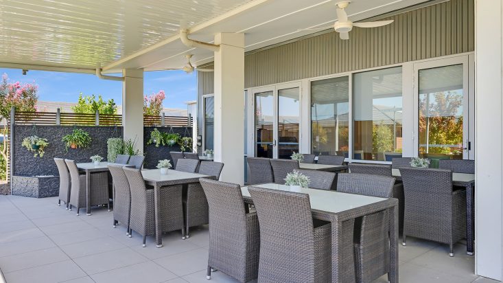 Outdoor dining underneath patio at Shanagolden Community Centre