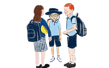 Three school children talking in a circle