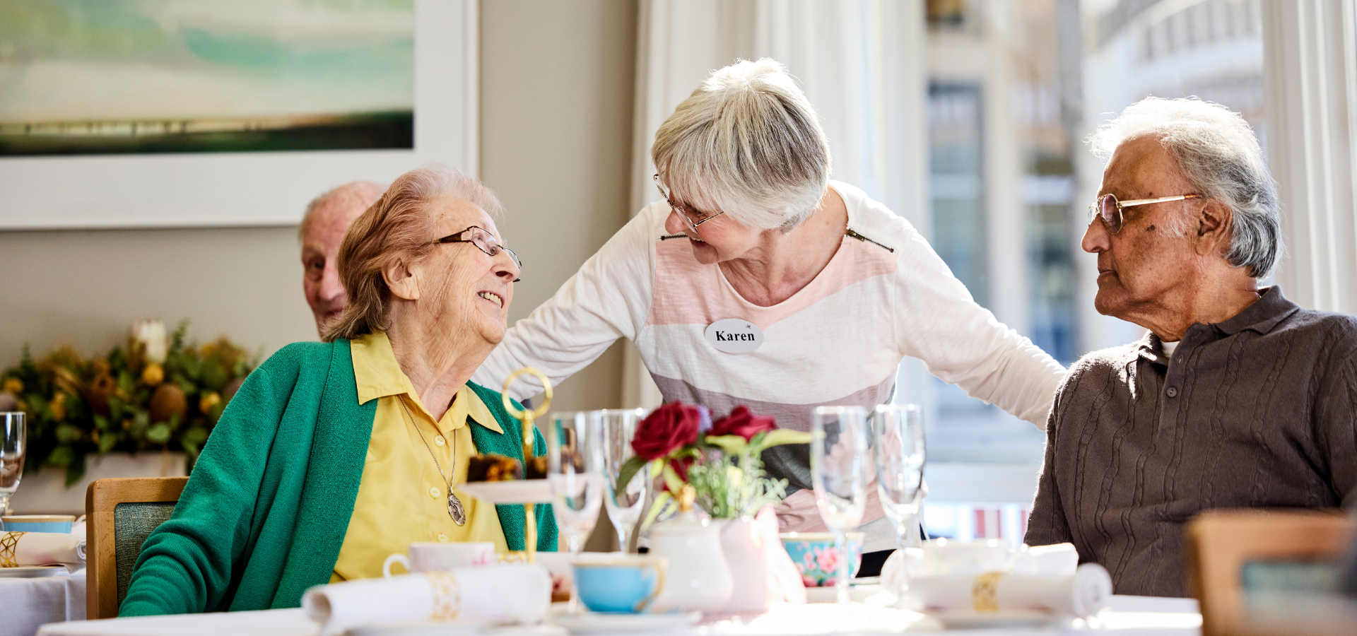 two women share a laugh in aged care