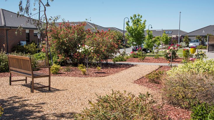 A garden with a gravel path atShangolden Aged Care Pakenham