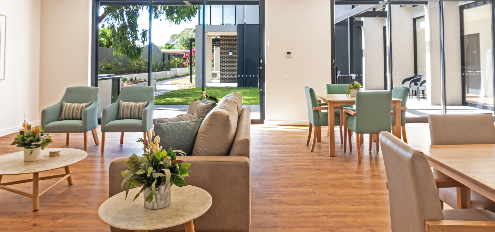 A lounger area overlooking a garden