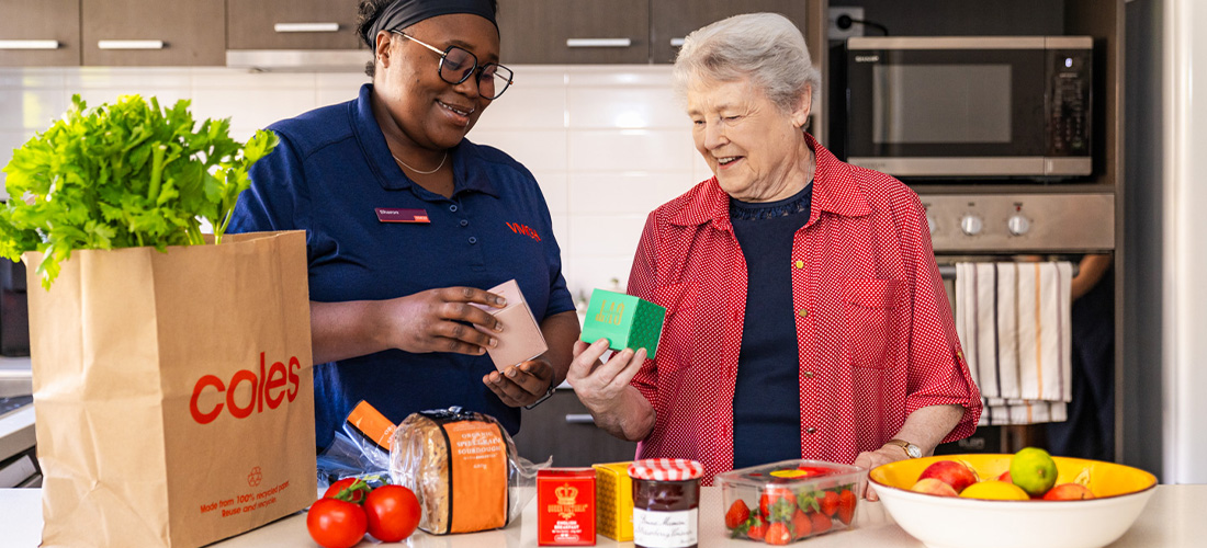 Sharon showing Eileen the groceries.