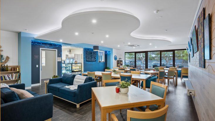 A café a blue feature wall where you order.