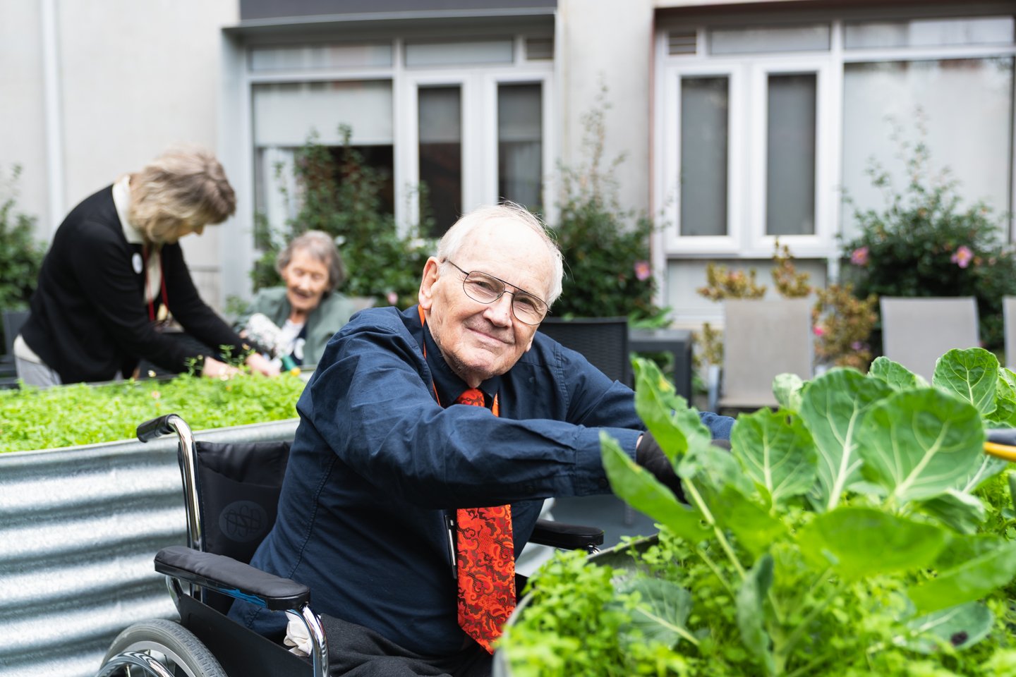 Aged care resident Gaeme enjoys planting vegies