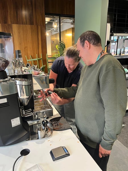 Trainee Craig learns how to make coffee with the support worker