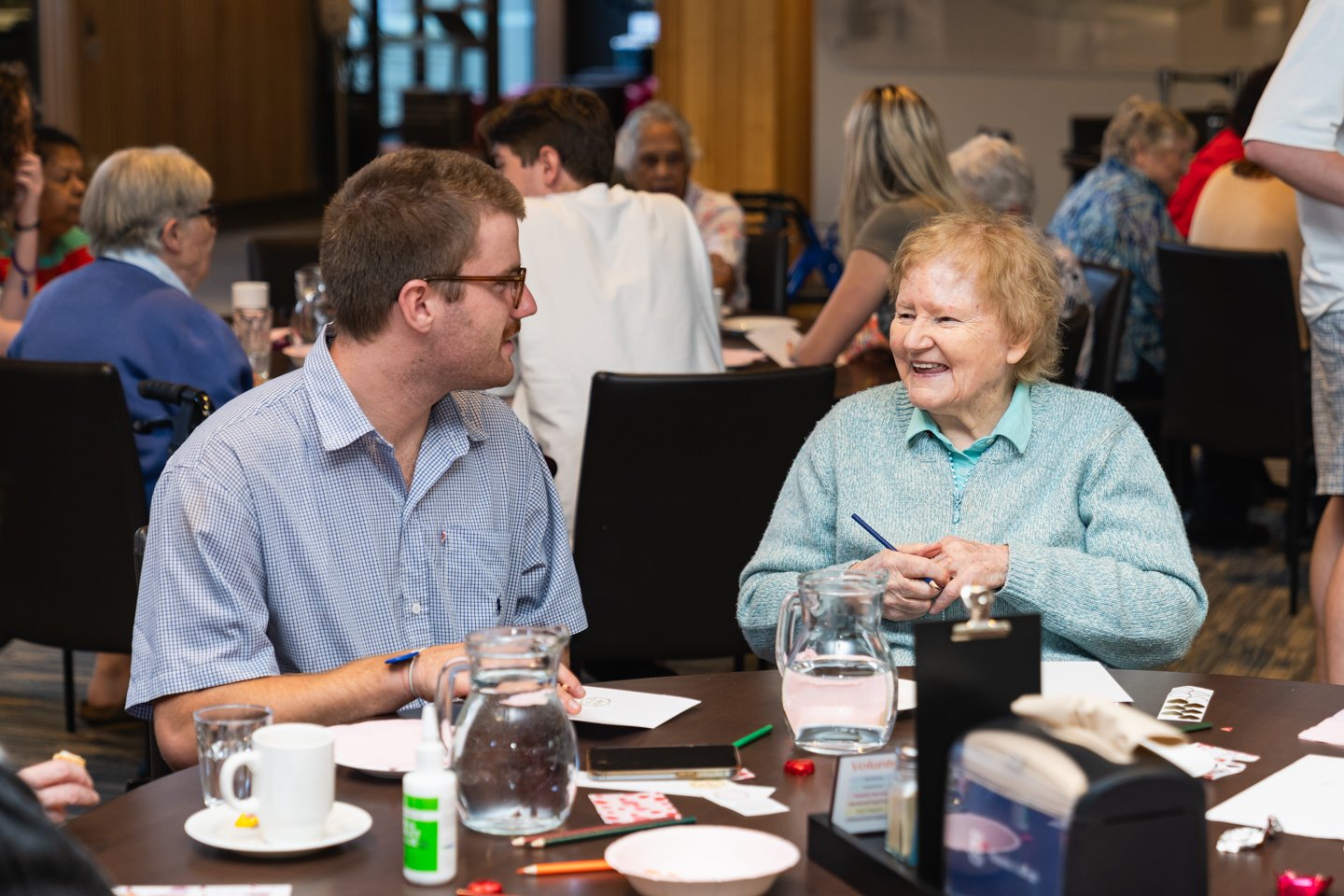 Two people sit at a table together