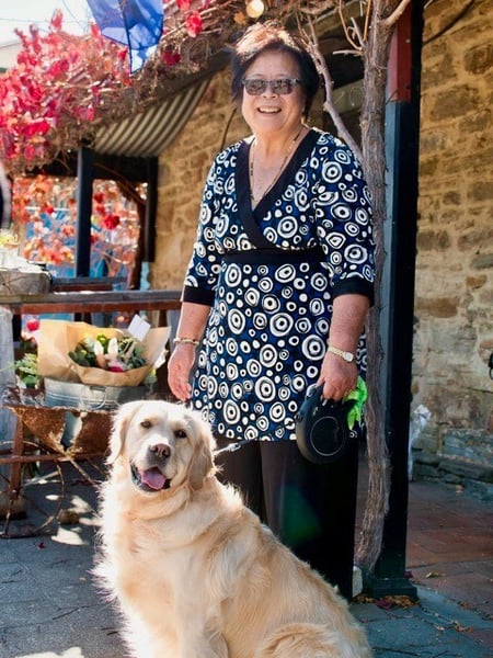 Volunteer Kitty Vivekanada pictured with her golden retriever 