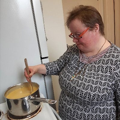 Woman cooking soup